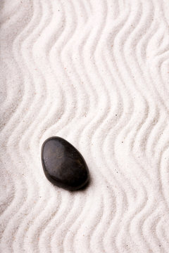 An oriental rock garden background with stones and sand