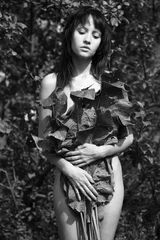 Zelfklevend Fotobehang Young pretty woman in the summer garden © Egor Mayer