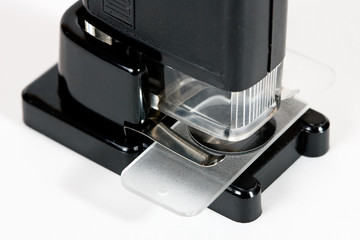 Pocket microscope on white background
