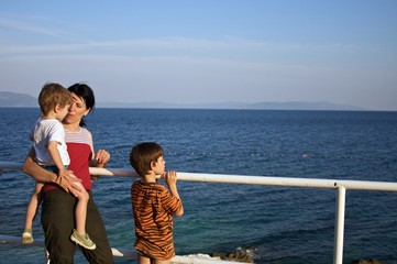 family admiring the sea view