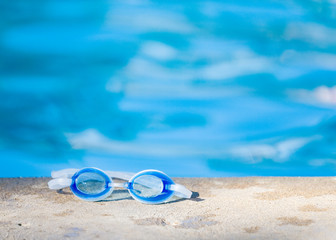 Fototapeta na wymiar Goggles at edge of pool