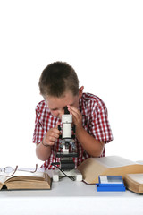 child looking through his microcope