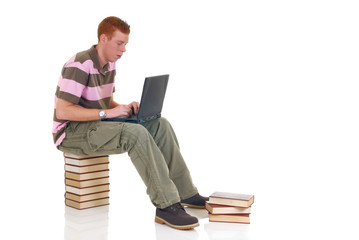 trendy handsome male teenager student doing schoolwork
