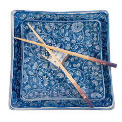 Square Oriental plates with chopsticks