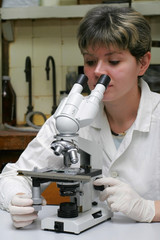 Scientist and microscope