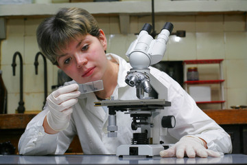 Scientist and microscope