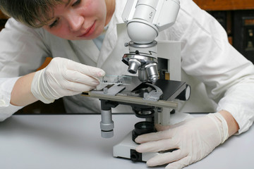Scientist and microscope