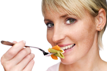 young blond woman eating pasta close up shoot
