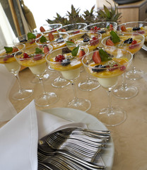 Arrangement of banquet table - berry desserts, dishware etc