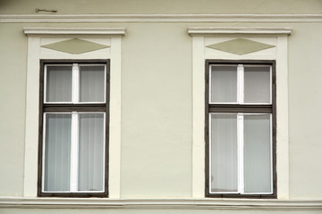 two romanian classic windows on painted wall