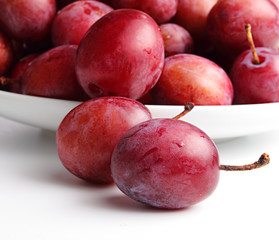 Plums on a white background