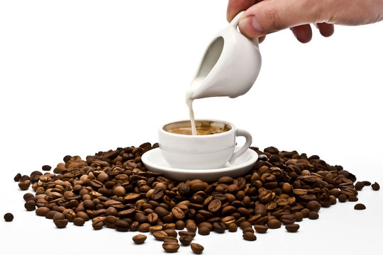 Cream Being Poured Into Coffee