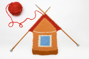 The amusing knitted house  against white