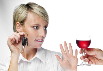 young blond woman with car keys declining drink close up