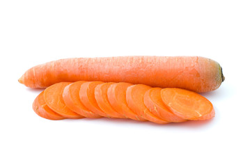 Ripe fresh long carrot and some slices isolated on the white