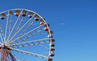 Ferris wheel on background blue sky