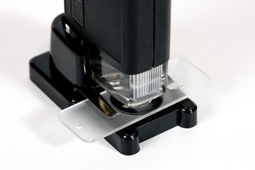 Pocket microscope on white background