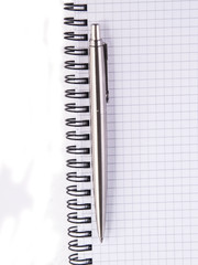 Pen and notebook, isolated on white background.