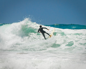 Surfer on an amazing wave on a perfect sunny day © Ant Clausen
