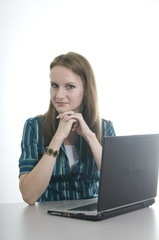 brunette working at various tasks in her office