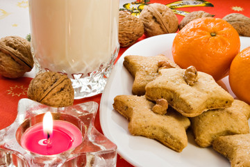 homemade cookies with glass of milk left for Santa Claus
