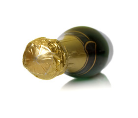 The champagne bottle lays on a white background. Isolation