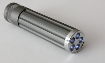 Flashlight on gray paper