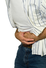 A man holding his stomach because he has diarrhea