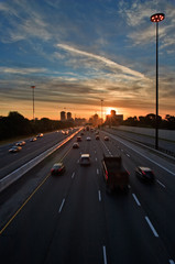 Cars on the highway at the beginning of morning rush hour