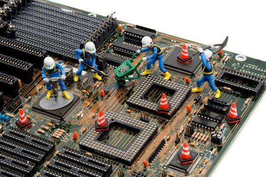 construction site - little workers repairing motherboard - Powered by Adobe