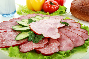 Tasty sausages on the red background.