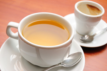 cup of green tea and empty cap of coffee, shallow DOF
