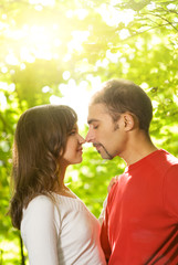 Young couple in love outdoors. Close-up portrait