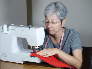 Woman working on a sewing machine 004