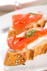 canape with smoked salmon, cream cheese spread and dill