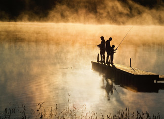 Early morning fishing in autumn on a lake