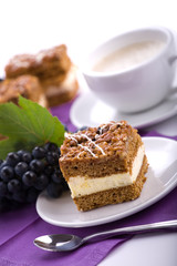 Delicious cream cake and coffee.