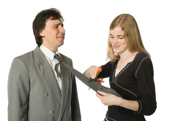 Pretty woman cutting man's necktie with scissors