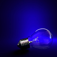 blue background classic light bulb with space for write