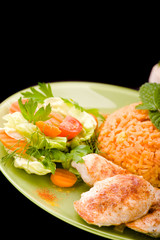 Rice, fried chicken and vegetables.