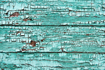Green painted cracked wooden plank