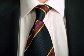 detail of a business man suit with colored tie
