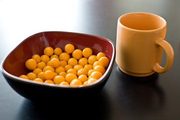 Bowl of cape gooseberry and cup