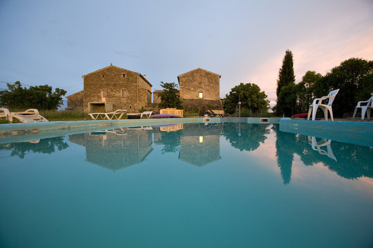 an empty swimming pool at sunset france