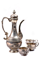 Old silver jug and goblets