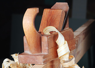 shaving and wooden plane,focus on a foreground