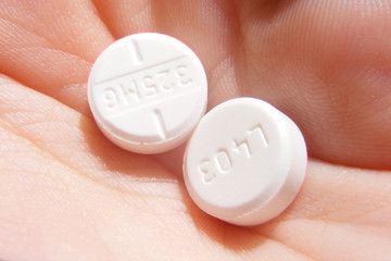 2 Pills in Hand (Close Up)