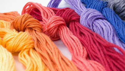 Close-up of colorful buns of threads