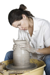 Picture of a potter works a potter's wheel