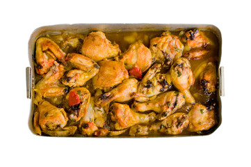 roasted chicken in an old and grunge oven tray